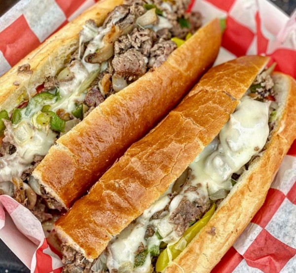 Two Daniel’s cheesesteaks in a basket